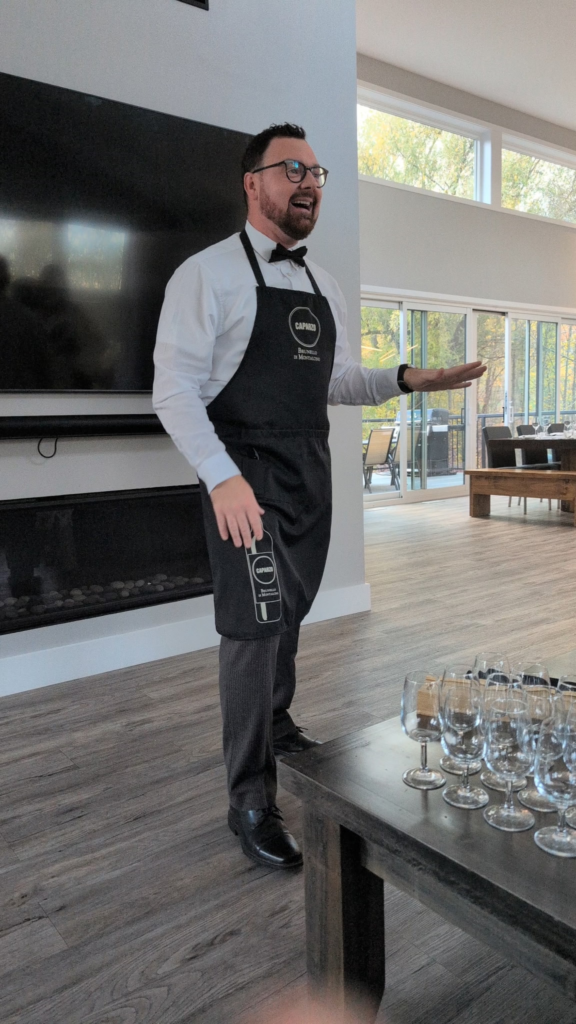 Sommelier Daniel McDonough presenting wine at a Culinary & Cork private dinner